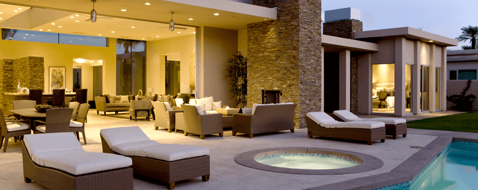 Poolside view of the interior living space of a modern upscale home open concept lanai style.