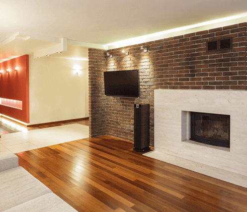 a clean and shiny re-finished hardwood floor is the focal point of this renovated living room