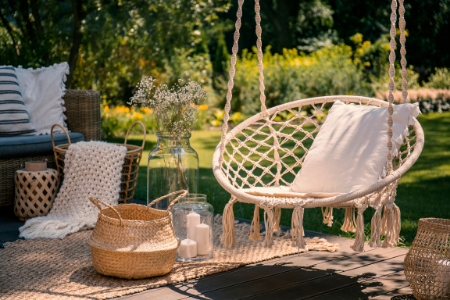 The perfect summer hammock chair hanging over a patio.