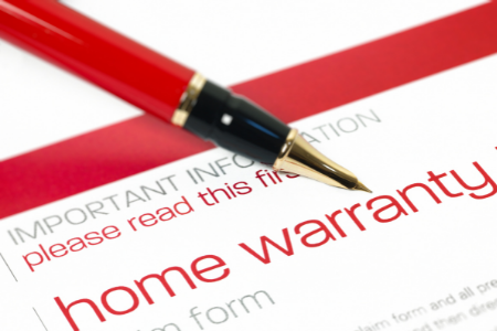 A red pen ready to sign a home warranty plan.