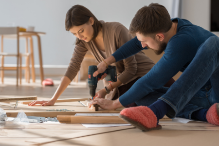 A couple working on a home improvement project together.