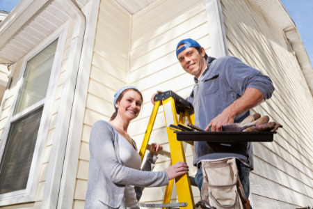 A couple keeps up on home repairs, a strategy we recommend to boost your bank account.