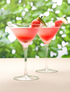 Two watermelon martinis on a table, a perfect summer cocktail.