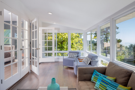 an porch that has been enclosed and made into a sunroom