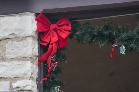 Garland hung in the corners of a garage door.