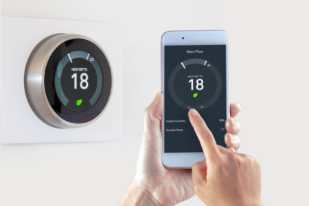 A smart thermostat connected to an app.