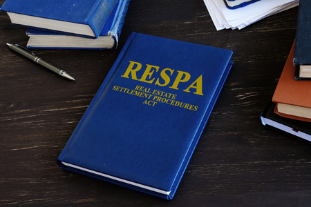 A blue book with "RESPA" on the cover.