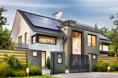 A modern home with solar panels on the roof.
