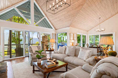 A living room arranged perfectly with furniture and decor.