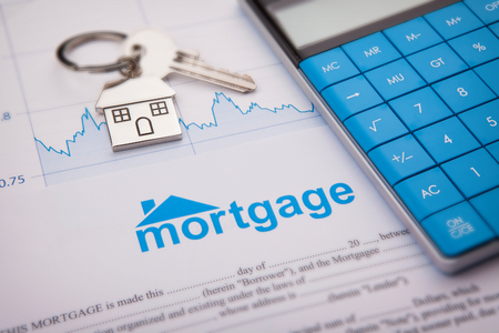 A document with mortgage details and a calculator implying consideration of a 50-year mortgage.