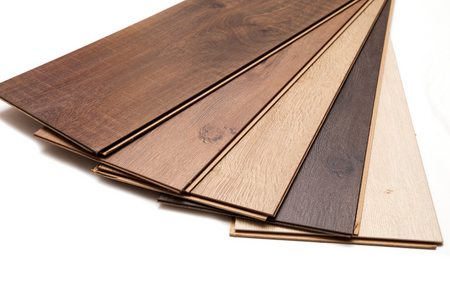 Laminate planks of various shades as an example of flooring options.