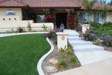 A front yard with spruced up landscaping for summer.