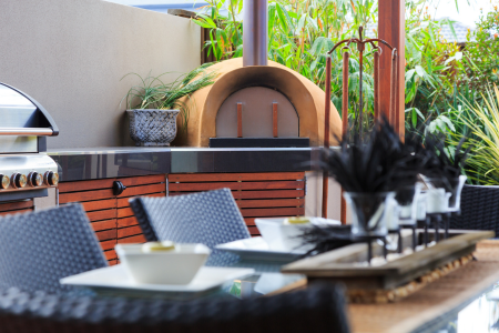 A built-in pizza oven, one outdoor kitchen appliance to consider adding to your home.