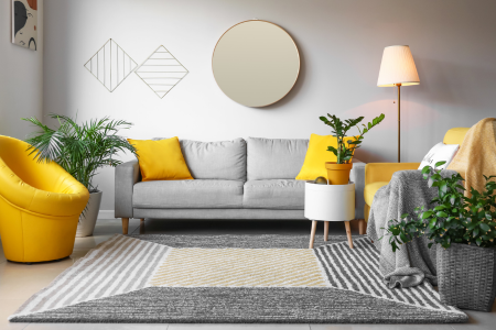 A living room with pops of yellow showing a cohesive design.