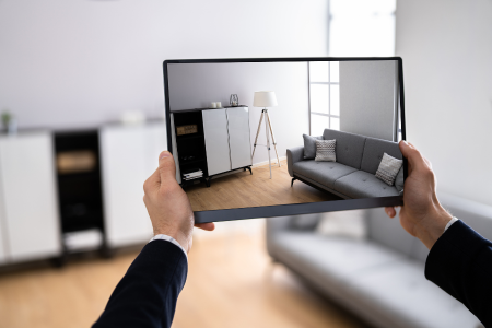 A person holding a tablet that is using VR to record a home tour.