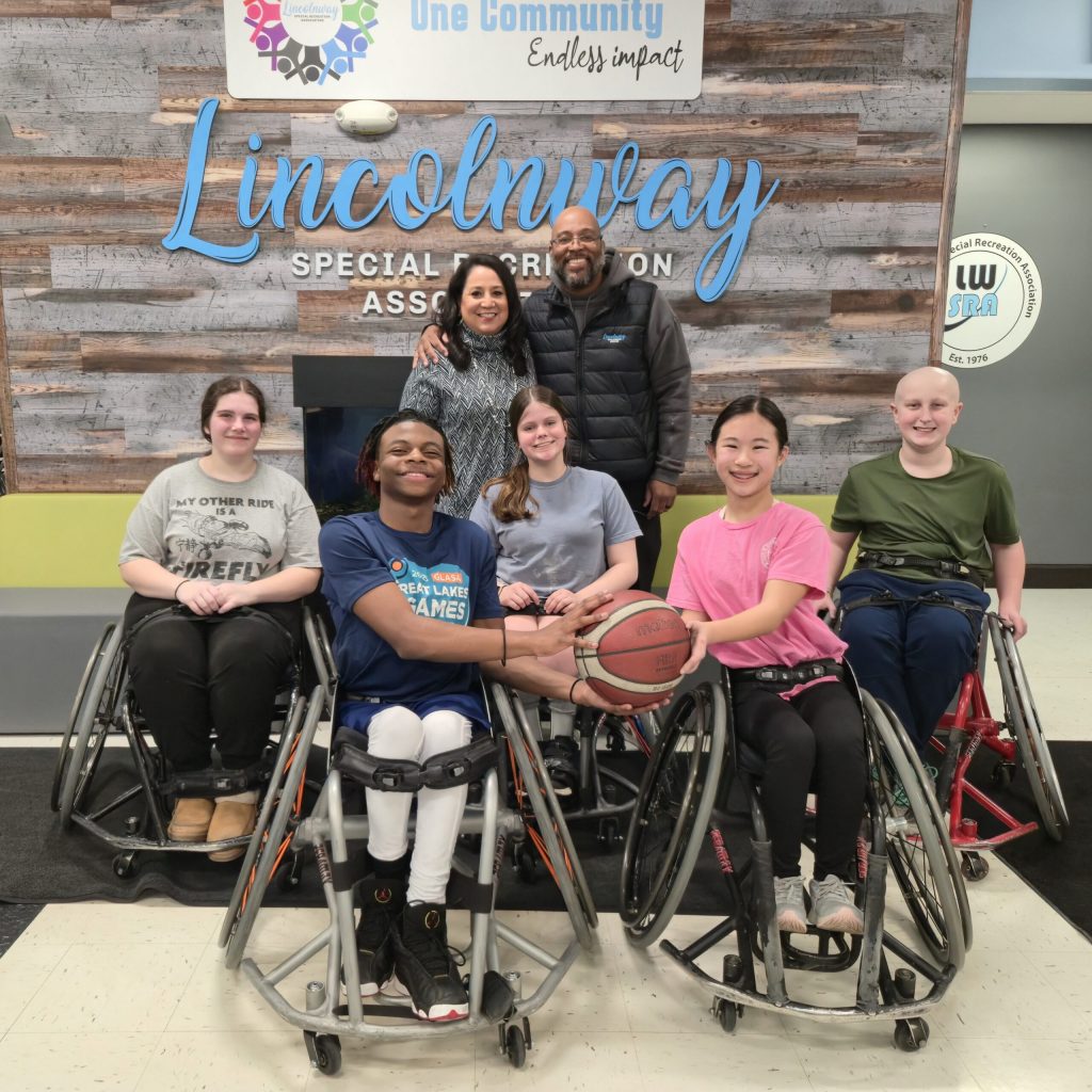 Maribel Salgado-Little and a group of basketball players from Lincolnway Special Recreation Association.