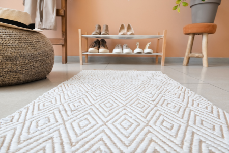 A washable rug makes cleaning simple and a way to address dirt and sand that collects in the home.