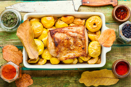 Apples and onions cooked with pork in a giant roast.