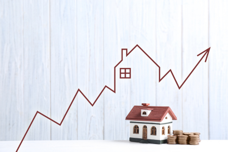 An image of a home with a line chart above it, indicating property price growth over time.