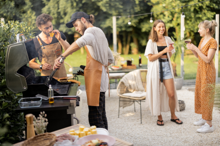 Friends summer entertaining around the backyard bbq.