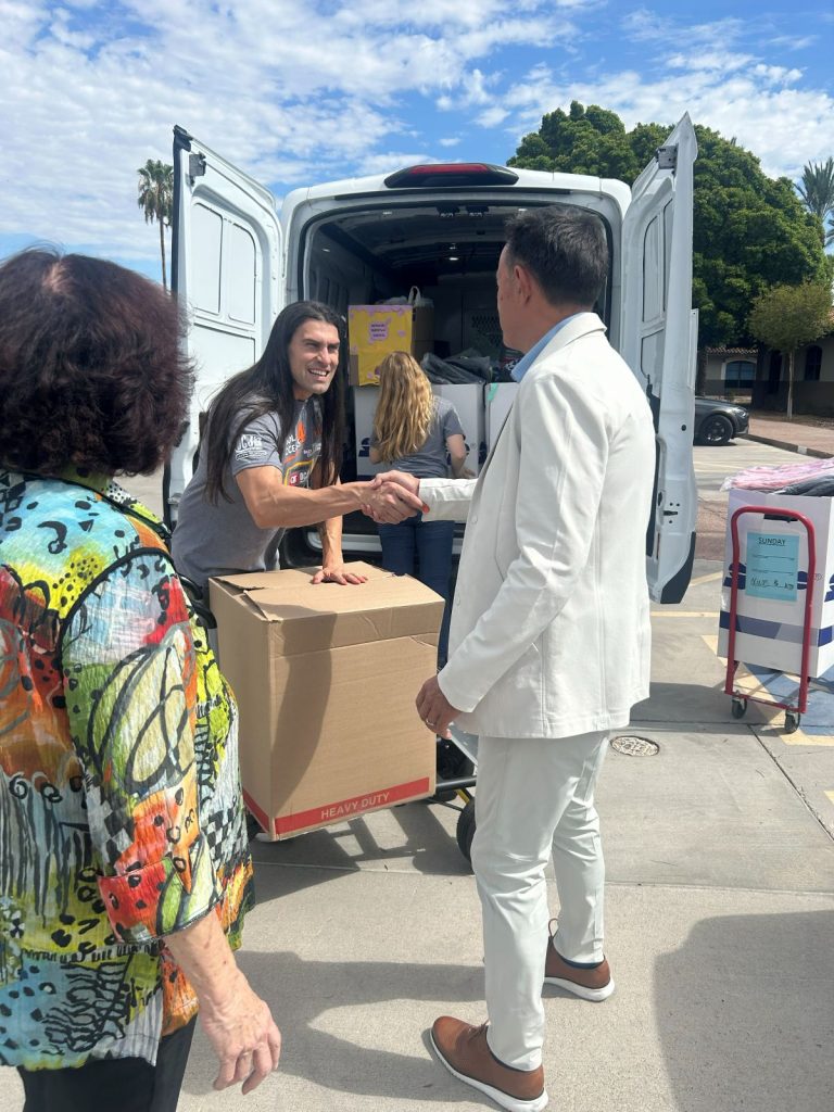 Realty Executives International's President, Patrick van den Bossche, connecting with the OCJ Kids team.
