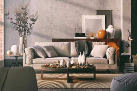 A living room with elegant fall interior design concepts, such as chunky textiles and natural fibers.