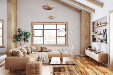 A living room with customized to owners' tastes with built in shelving, unique beams, and wood flooring.